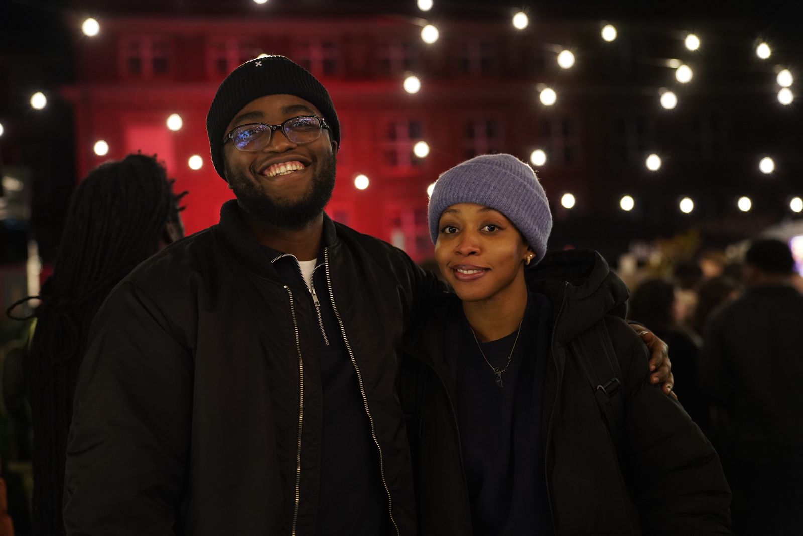 Chisom and Enoch together beneath evening lights