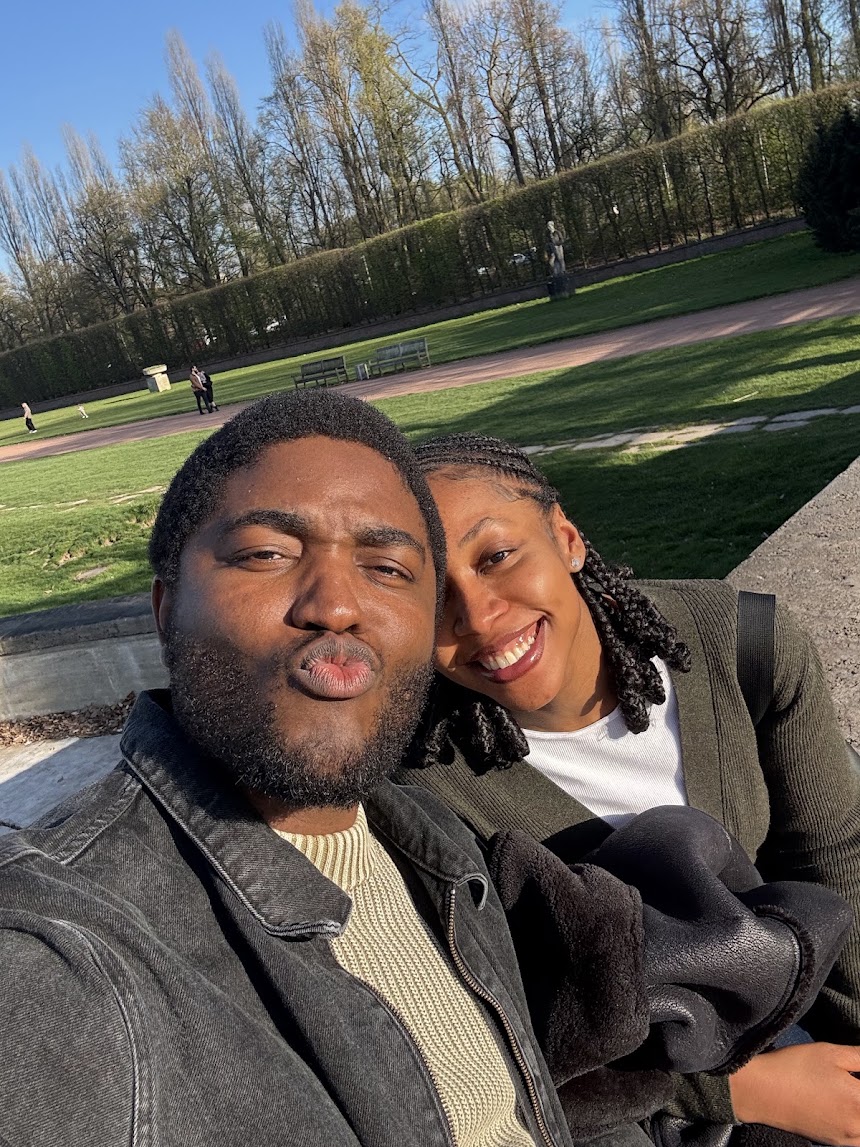 Chisom and Enoch smiling together outdoors